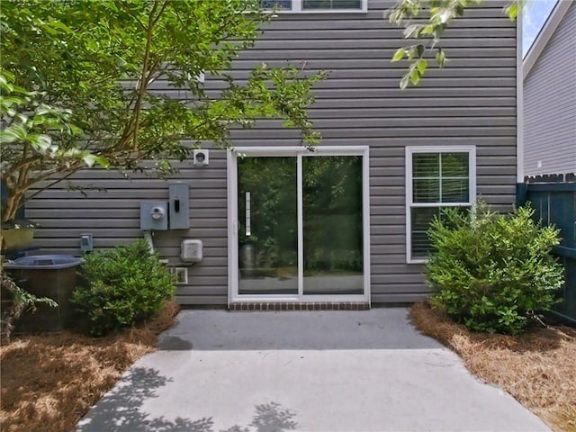 180 Kepler Loop, Richmond Hill, GA 31324 - property entrance with central AC unit and a patio area