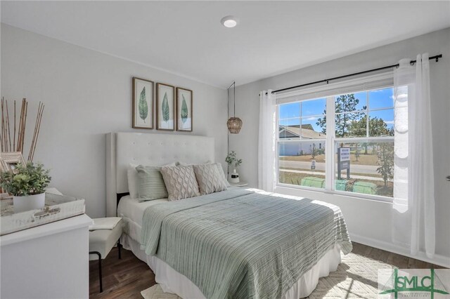 bedroom featuring wood finished floors