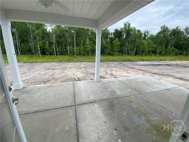152 Como Dr, Pooler, GA 31322 - view of patio featuring a ceiling fan and a wooded view