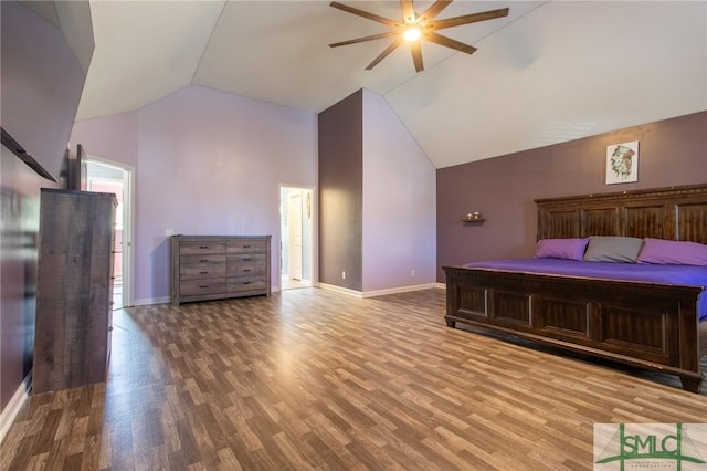 126 NE Owens St, Ludowici, GA 31316 - unfurnished bedroom with high vaulted ceiling, a ceiling fan, baseboards, and wood finished floors