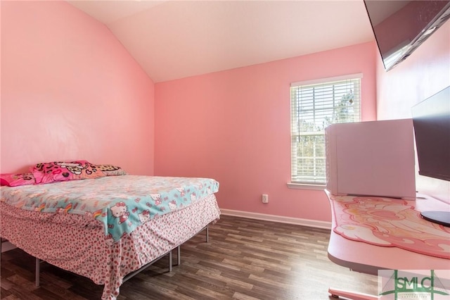 126 NE Owens St, Ludowici, GA 31316 - bedroom featuring vaulted ceiling, wood finished floors, and baseboards