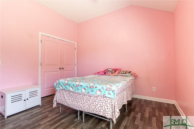126 NE Owens St, Ludowici, GA 31316 - bedroom featuring vaulted ceiling, wood finished floors, and baseboards