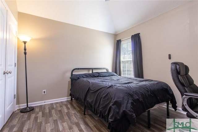 126 NE Owens St, Ludowici, GA 31316 - bedroom with baseboards, lofted ceiling, and wood finished floors