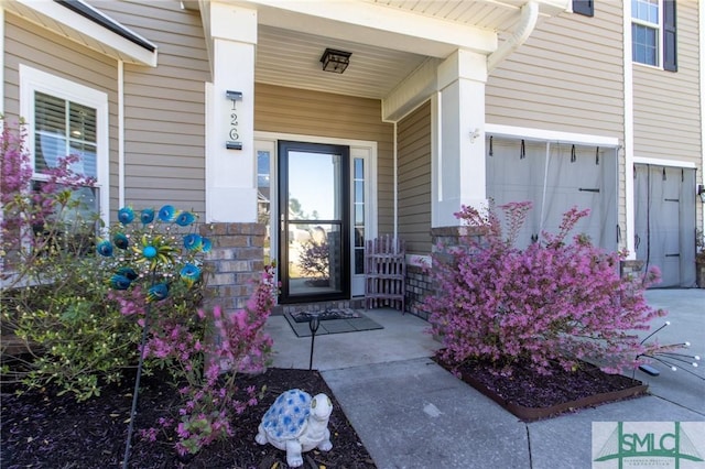 126 NE Owens St, Ludowici, GA 31316 - doorway to property with a porch