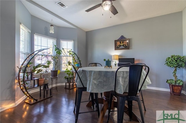126 NE Owens St, Ludowici, GA 31316 - dining area featuring dark wood-type flooring, baseboards, visible vents, and ceiling fan