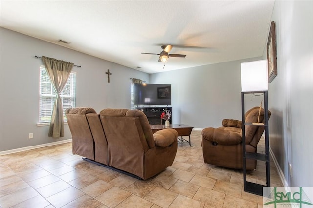 126 NE Owens St, Ludowici, GA 31316 - living area featuring a ceiling fan, visible vents, and baseboards