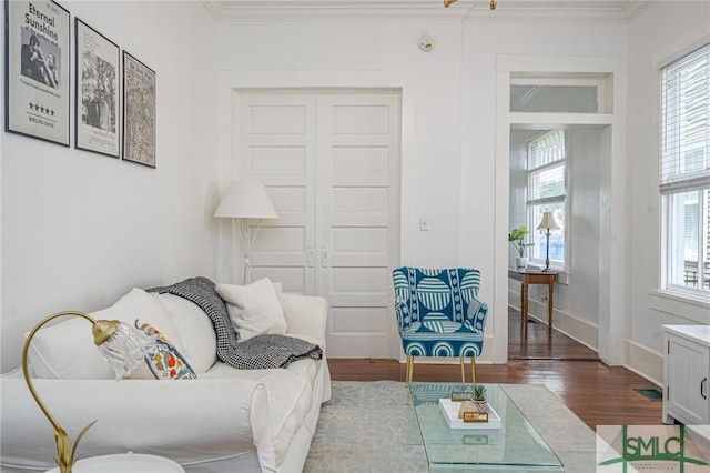 2210 Bull St, Savannah, GA 31401 - living area with crown molding, wood finished floors, and baseboards