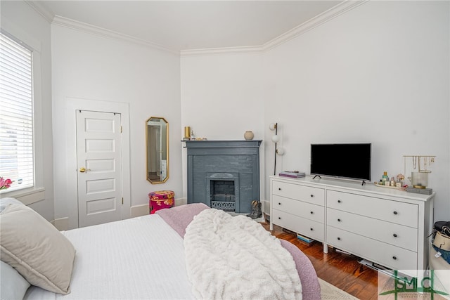 2210 Bull St, Savannah, GA 31401 - bedroom with a fireplace, dark wood-style floors, and ornamental molding