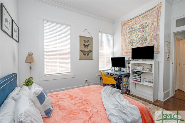 2210 Bull St, Savannah, GA 31401 - bedroom featuring multiple windows, wood finished floors, and ornamental molding