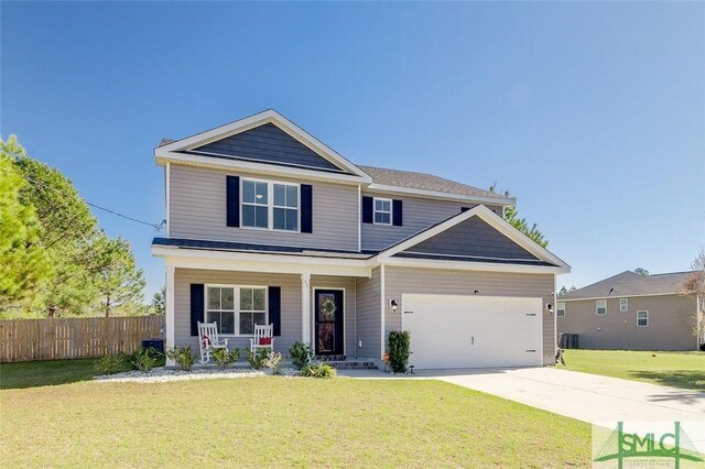 55 Saddlebrush Rd, Ellabell, GA 31308 - craftsman-style home featuring a front lawn, fence, an attached garage, and concrete driveway