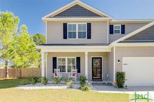 55 Saddlebrush Rd, Ellabell, GA 31308 - view of front of home featuring a porch, fence, and a front lawn