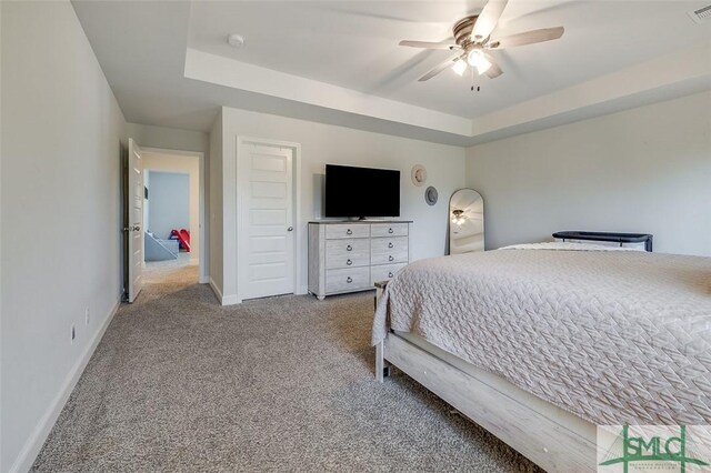 55 Saddlebrush Rd, Ellabell, GA 31308 - bedroom with visible vents, a tray ceiling, baseboards, and carpet floors