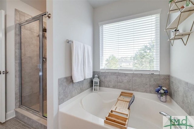 55 Saddlebrush Rd, Ellabell, GA 31308 - bathroom featuring a shower stall, a bath, and a healthy amount of sunlight