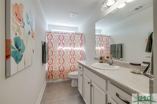 55 Saddlebrush Rd, Ellabell, GA 31308 - full bath with vanity, visible vents, baseboards, and toilet