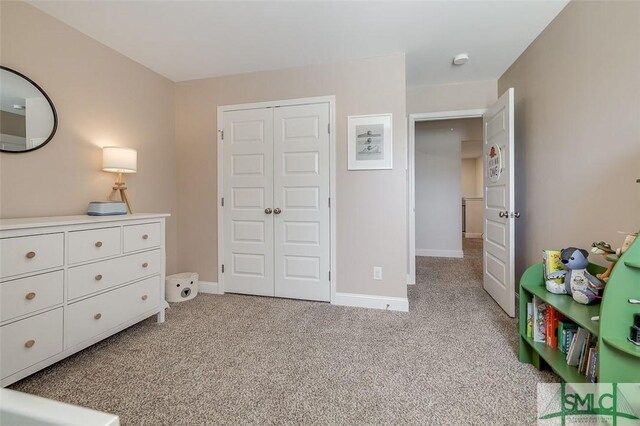 55 Saddlebrush Rd, Ellabell, GA 31308 - bedroom featuring light colored carpet, baseboards, and a closet
