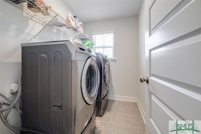 55 Saddlebrush Rd, Ellabell, GA 31308 - washroom with light tile patterned floors, baseboards, washer and dryer, and laundry area