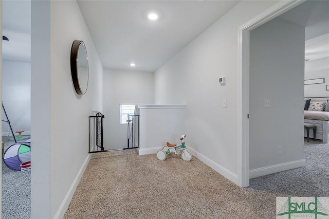 55 Saddlebrush Rd, Ellabell, GA 31308 - hallway with carpet flooring, baseboards, and an upstairs landing