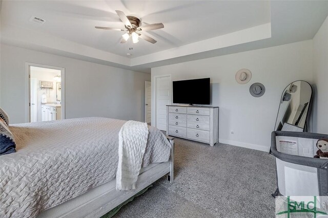 55 Saddlebrush Rd, Ellabell, GA 31308 - carpeted bedroom with a raised ceiling, baseboards, a ceiling fan, and connected bathroom