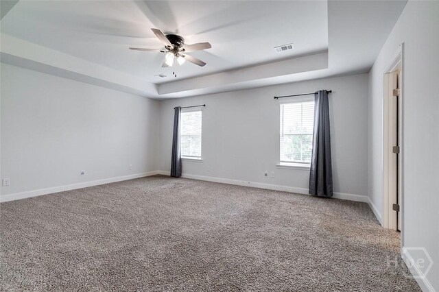 55 Saddlebrush Rd, Ellabell, GA 31308 - spare room with a raised ceiling, a ceiling fan, carpet, and baseboards