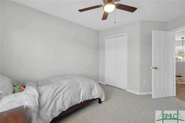 bedroom featuring a closet, carpet flooring, ceiling fan, and baseboards