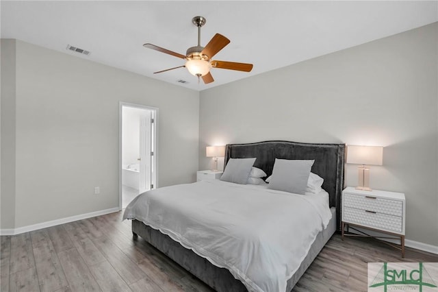 bedroom featuring visible vents, ceiling fan, baseboards, and wood finished floors
