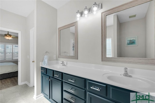 full bathroom with a ceiling fan, a healthy amount of sunlight, and a sink