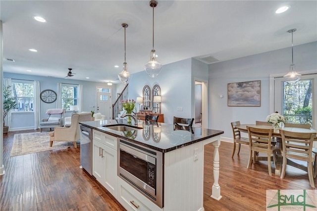 kitchen featuring a sink, recessed lighting, dark wood-style flooring, and stainless steel appliances