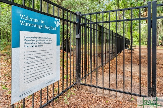 view of gate with fence