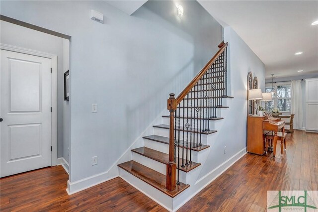 stairs with baseboards, recessed lighting, and hardwood / wood-style flooring