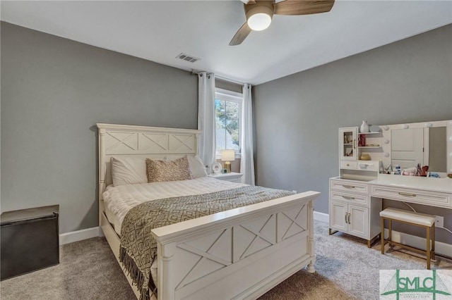 bedroom with visible vents, ceiling fan, light carpet, and baseboards