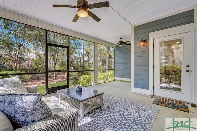 sunroom with outdoor lounge area, a wealth of natural light, and ceiling fan