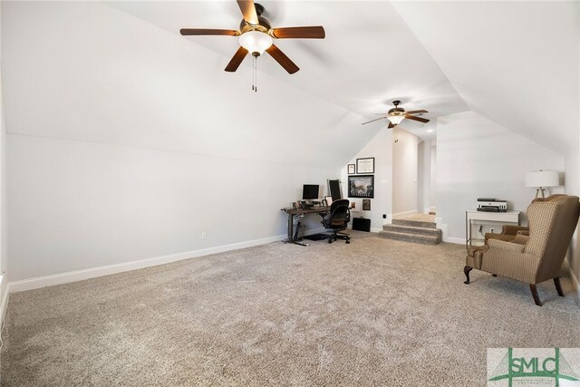 office area with ceiling fan, carpet flooring, lofted ceiling, and baseboards