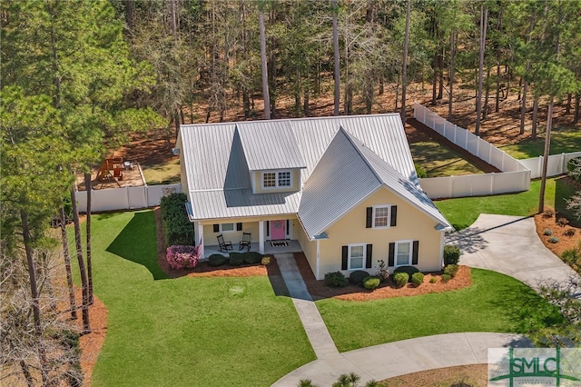 view of front of home with covered porch, metal roof, and stucco siding