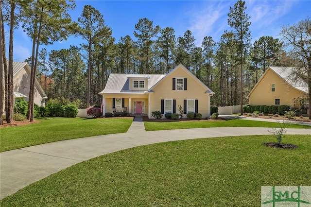 view of front of property featuring metal roof and a porch
