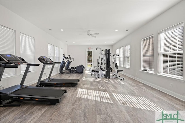 workout area featuring recessed lighting, ceiling fan, baseboards, and wood finished floors