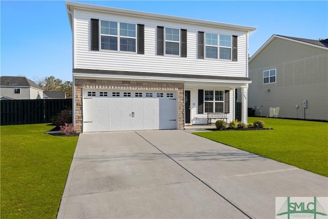 view of front of home featuring a front lawn, covered porch, stone siding, and driveway