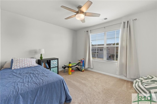 bedroom with visible vents, ceiling fan, baseboards, and carpet floors