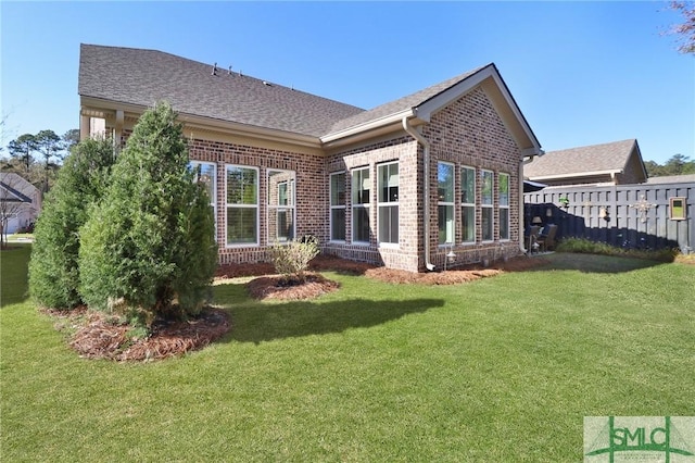 117 Hope Ln Unit A, Savannah, GA 31406 - rear view of house with brick siding and a shingled roof