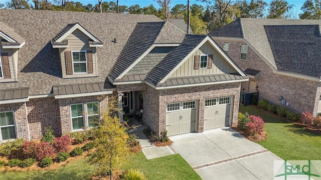 117 Hope Ln Unit A, Savannah, GA 31406 - view of front facade with brick siding, board and batten siding, driveway, and a front lawn