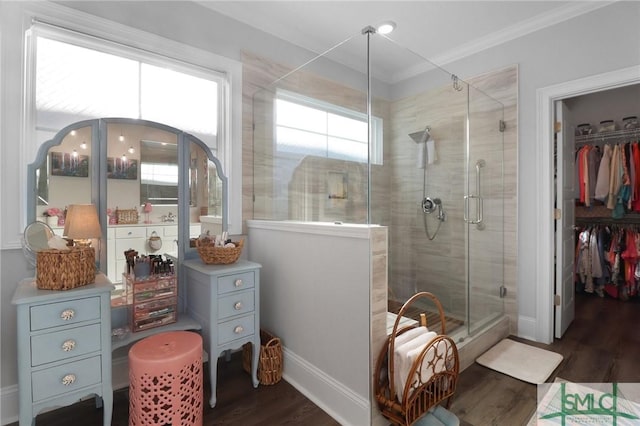 117 Hope Ln Unit A, Savannah, GA 31406 - full bathroom with wood finished floors, a stall shower, ornamental molding, baseboards, and a walk in closet