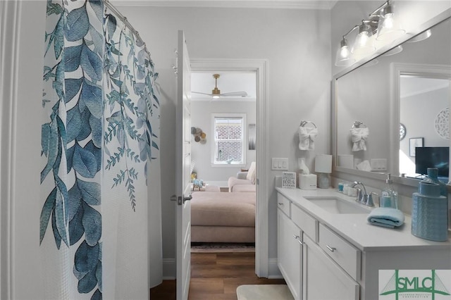 117 Hope Ln Unit A, Savannah, GA 31406 - bathroom featuring wood finished floors, vanity, ornamental molding, ceiling fan, and ensuite bath