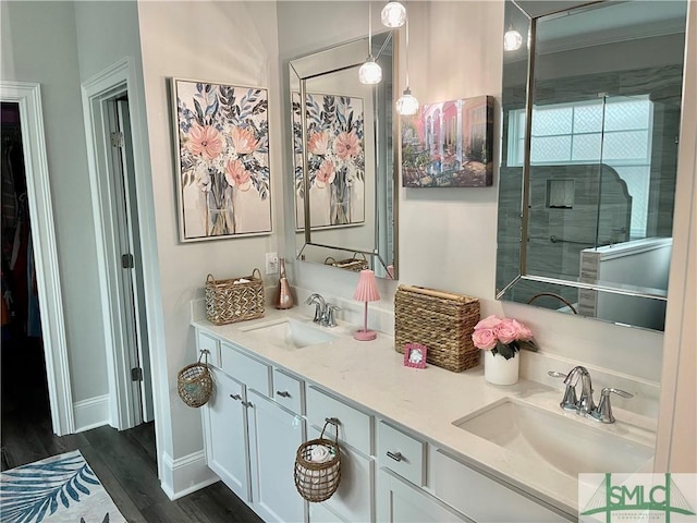 117 Hope Ln Unit A, Savannah, GA 31406 - bathroom featuring wood finished floors, double vanity, and baseboards