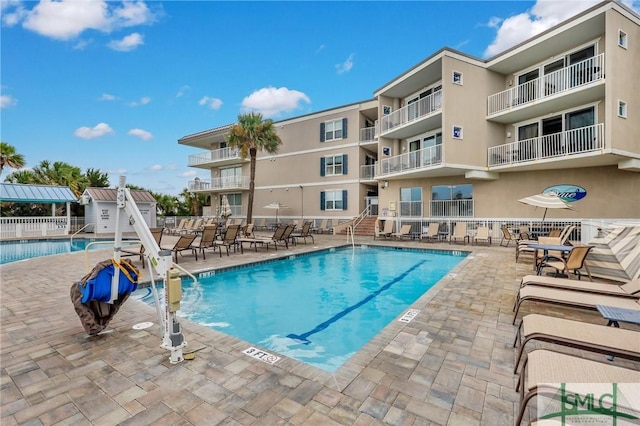 pool with a patio area