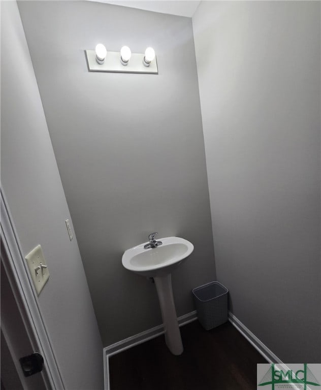 12 Noble Jones Ct, Port Wentworth, GA 31407 - bathroom featuring baseboards and wood finished floors