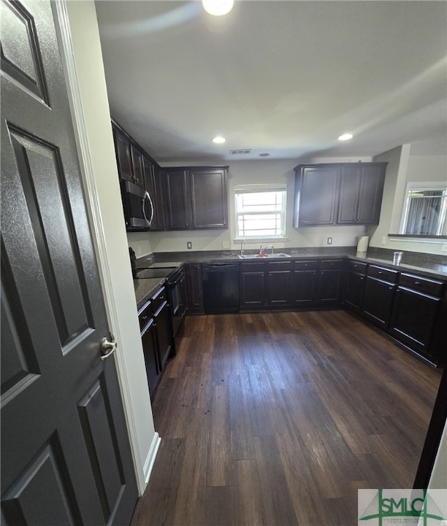 12 Noble Jones Ct, Port Wentworth, GA 31407 - kitchen featuring dark wood-style flooring, dark countertops, recessed lighting, a sink, and black appliances