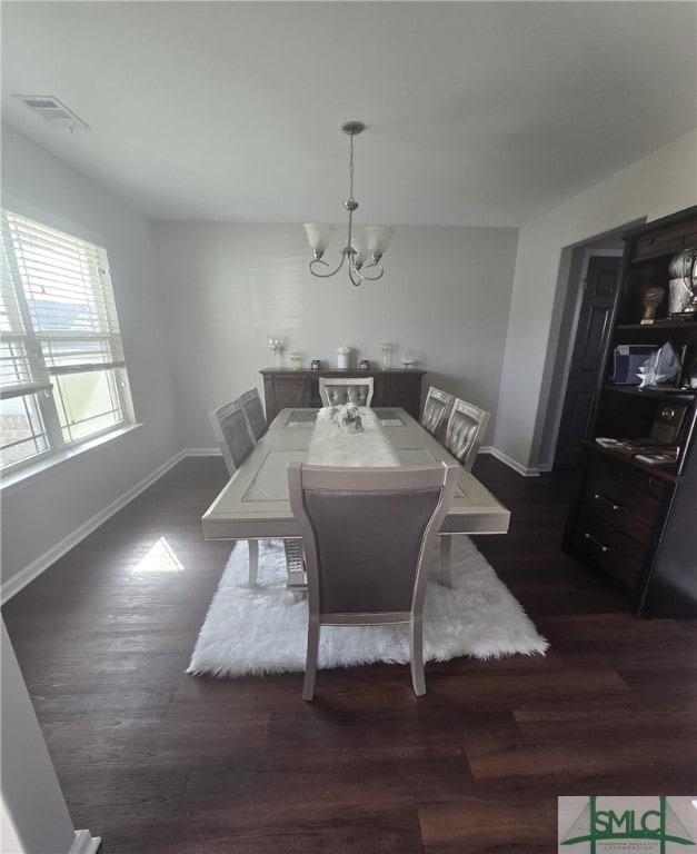 12 Noble Jones Ct, Port Wentworth, GA 31407 - dining room featuring baseboards, a notable chandelier, dark wood-style floors, and visible vents