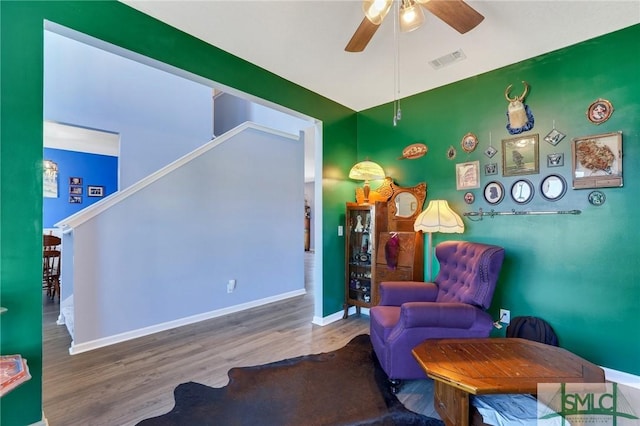 53 Boykin Way NE, Ludowici, GA 31316 - living area with visible vents, baseboards, ceiling fan, and wood finished floors