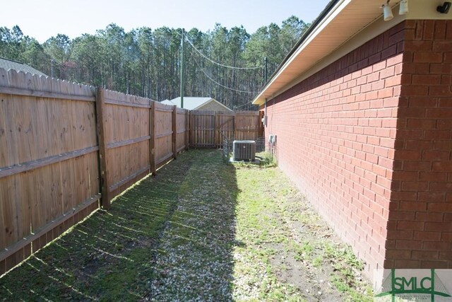 350 Clark St, Richmond Hill, GA 31324 - view of yard featuring cooling unit and a fenced backyard