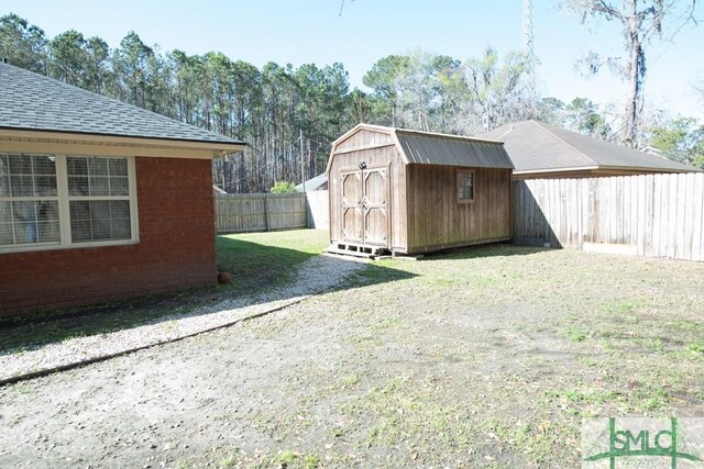 350 Clark St, Richmond Hill, GA 31324 - exterior space with a storage shed, an outbuilding, and a fenced backyard