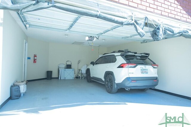 350 Clark St, Richmond Hill, GA 31324 - interior space featuring a garage door opener and baseboards